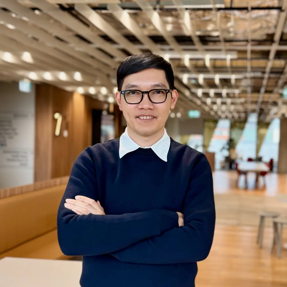 Hoa T. Nguyen, Research Scientist, standing with arms crossed